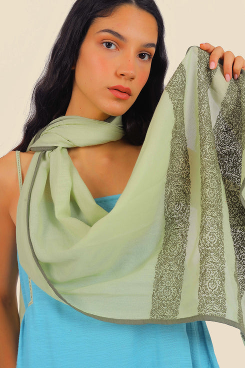 Embroidered shawl in cotton gauze.